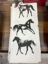 Load image into Gallery viewer, Michaelian Home off-white stamped kitchen towel with three black and white horses
